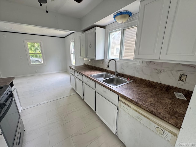 26439 Hopkins St, Dearborn, MI 48141 - kitchen featuring white dishwasher, stove, light marble finish floors, dark countertops, and a ceiling fan