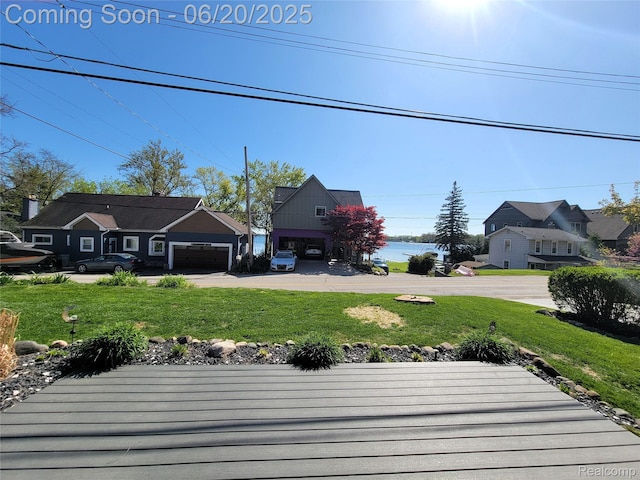 11329 E Shore Dr, Whitmore Lake, MI 48189 - view of grassy yard with a garage