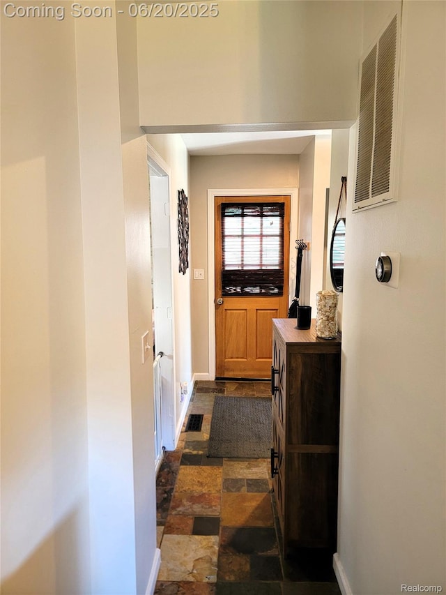 11329 E Shore Dr, Whitmore Lake, MI 48189 - corridor with dark stone finish flooring and baseboards
