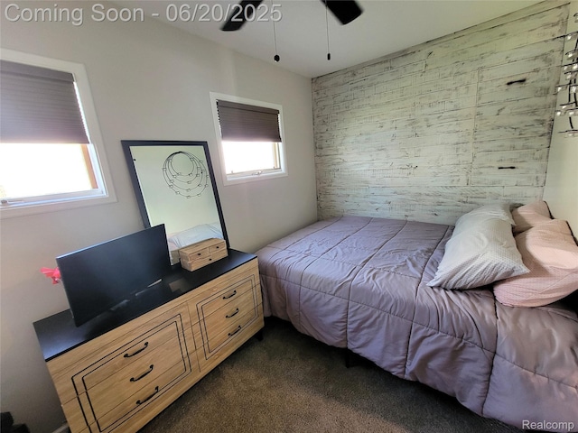 11329 E Shore Dr, Whitmore Lake, MI 48189 - bedroom with an accent wall, dark colored carpet, and a ceiling fan