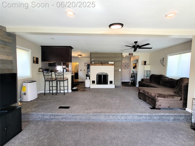 11329 E Shore Dr, Whitmore Lake, MI 48189 - carpeted living area with a ceiling fan, a brick fireplace, and recessed lighting