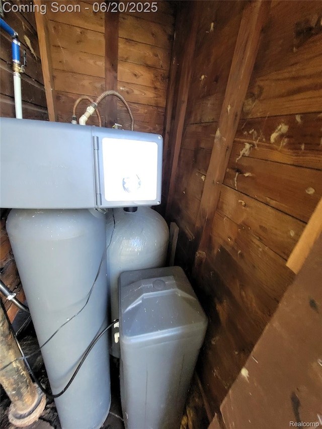 11329 E Shore Dr, Whitmore Lake, MI 48189 - detailed view of wood walls and a water softener