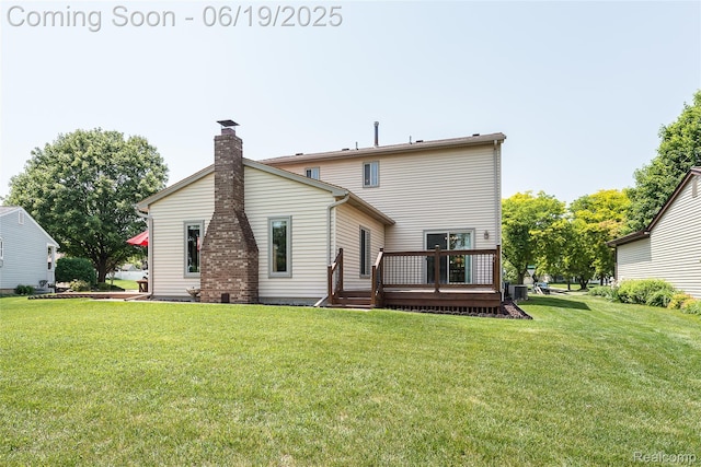 24320 Simmons Dr, Novi, MI 48374 - rear view of property with a deck, a chimney, and a lawn