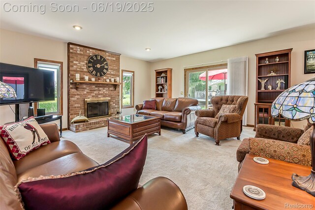 24320 Simmons Dr, Novi, MI 48374 - carpeted living room featuring a fireplace and recessed lighting