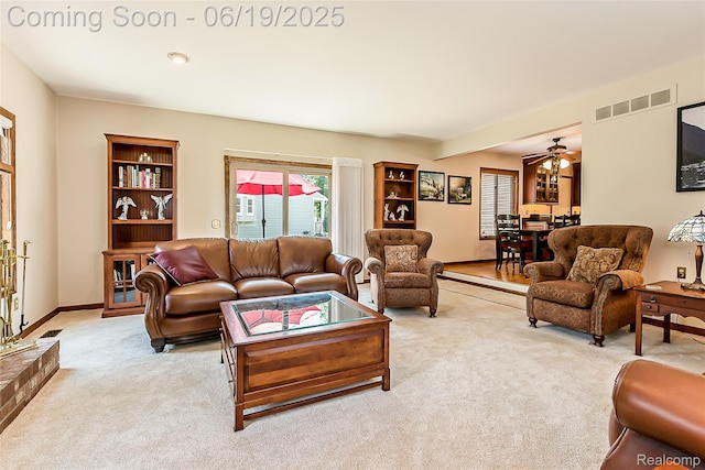 24320 Simmons Dr, Novi, MI 48374 - living area featuring light colored carpet and a ceiling fan