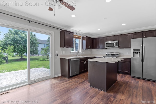 17922 Wingate Dr, Macomb, MI 48042 - kitchen with appliances with stainless steel finishes, light countertops, dark brown cabinets, dark wood-style flooring, and ornamental molding
