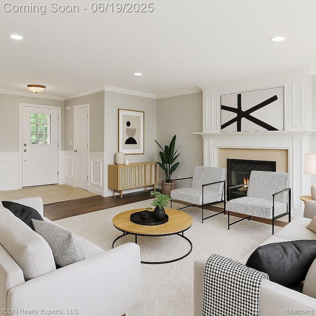 17922 Wingate Dr, Macomb, MI 48042 - living area with crown molding, wood finished floors, a tiled fireplace, recessed lighting, and a decorative wall