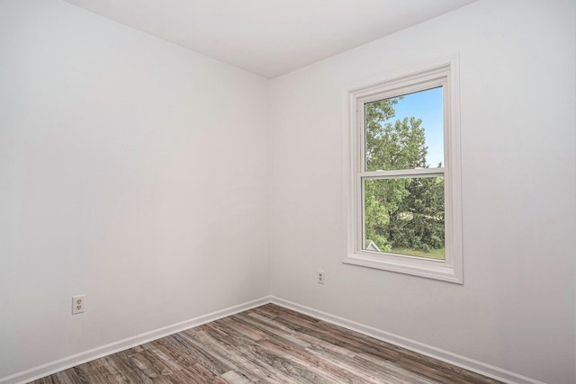 2502 Thorn Creek St SE, Kentwood, MI 49508 - empty room with plenty of natural light and wood finished floors