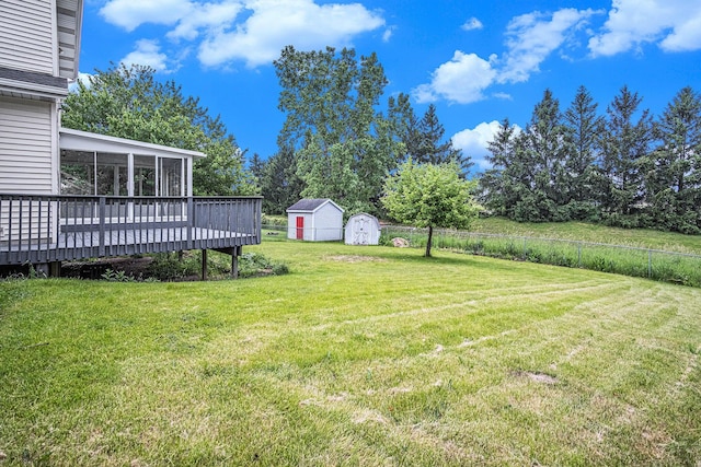 2502 Thorn Creek St SE, Kentwood, MI 49508 - view of yard featuring a storage unit, a deck, and a sunroom
