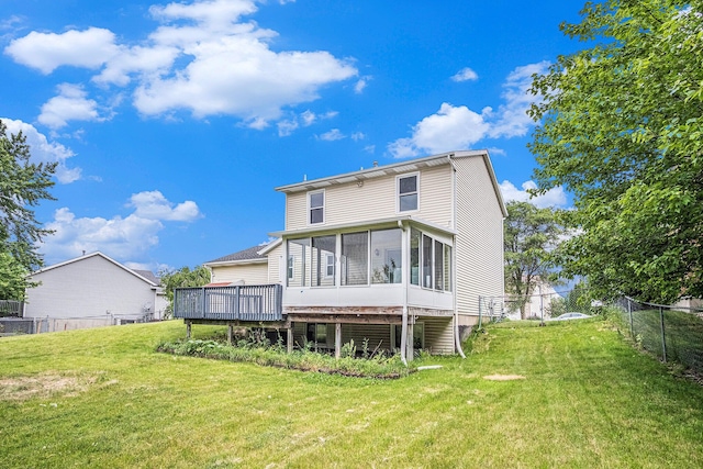 2502 Thorn Creek St SE, Kentwood, MI 49508 - back of property with a sunroom and a deck