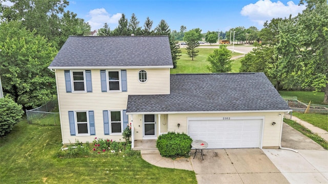 2502 Thorn Creek St SE, Kentwood, MI 49508 - traditional-style house with driveway, a shingled roof, and a garage
