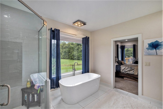 68363 Calvin Center Rd, Cassopolis, MI 49031 - bathroom with connected bathroom, a freestanding bath, a shower stall, and tile patterned floors
