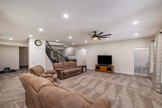 68363 Calvin Center Rd, Cassopolis, MI 49031 - carpeted living room featuring arched walkways, stairs, recessed lighting, and ceiling fan