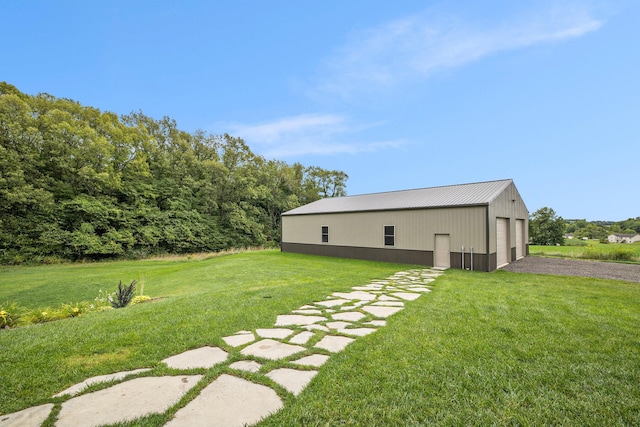 68363 Calvin Center Rd, Cassopolis, MI 49031 - view of grassy yard featuring an outbuilding, a garage, and a pole building