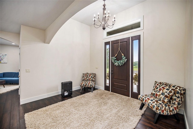 68363 Calvin Center Rd, Cassopolis, MI 49031 - entryway featuring a chandelier, arched walkways, and dark wood-style floors