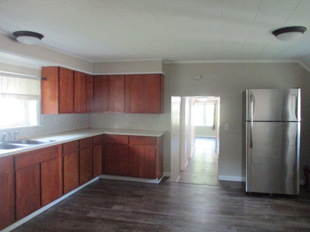 307 John St, Colon, MI 49040 - kitchen with freestanding refrigerator, brown cabinets, and light countertops