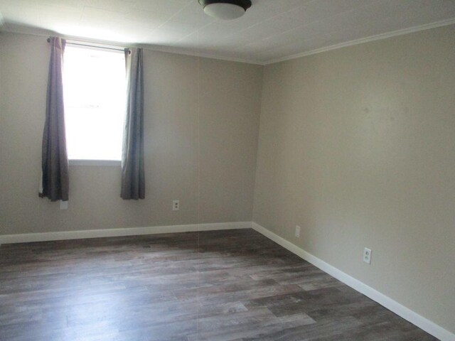 307 John St, Colon, MI 49040 - unfurnished room with crown molding and wood finished floors