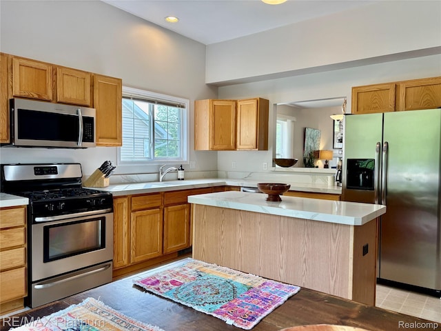 5089 Northfield Dr, Howell, MI 48843 - kitchen featuring appliances with stainless steel finishes, a kitchen island, and recessed lighting