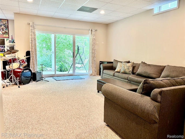5089 Northfield Dr, Howell, MI 48843 - carpeted living area featuring healthy amount of natural light and a drop ceiling