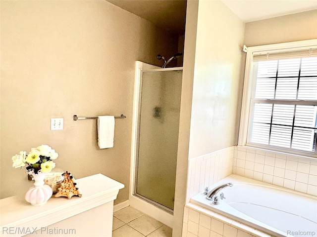 5089 Northfield Dr, Howell, MI 48843 - full bath featuring a shower stall, tile patterned flooring, and a garden tub