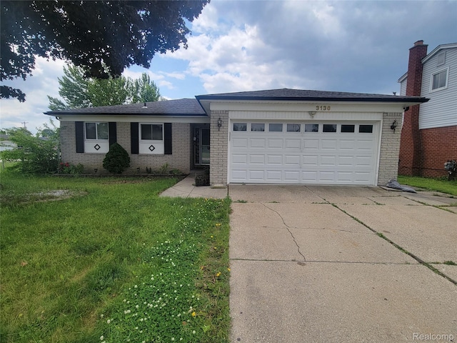 3136 Alden Dr, Sterling Heights, MI 48310 - ranch-style house featuring brick siding, an attached garage, driveway, and a front lawn