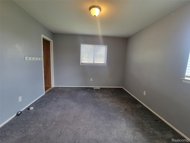 3136 Alden Dr, Sterling Heights, MI 48310 - empty room featuring dark carpet and baseboards