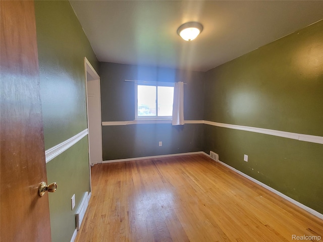 3136 Alden Dr, Sterling Heights, MI 48310 - unfurnished room with wood finished floors and baseboards