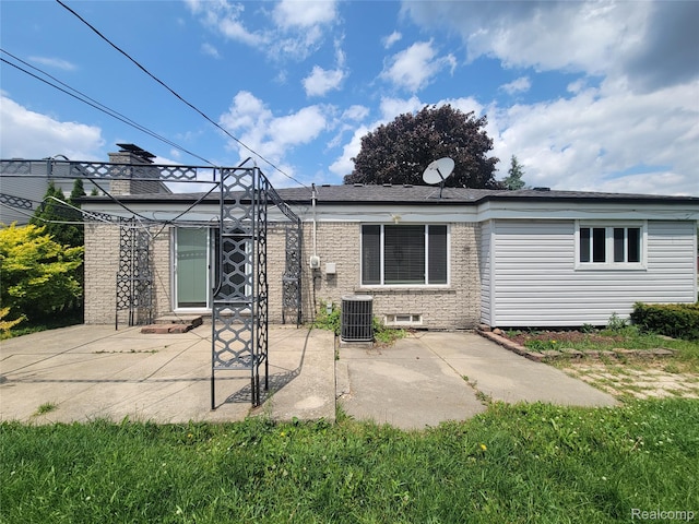 3136 Alden Dr, Sterling Heights, MI 48310 - rear view of property with a patio, brick siding, and an outdoor structure
