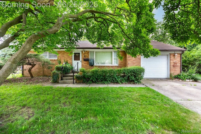 4144 Hillcrest Dr, Warren, MI 48092 - view of front of home featuring a garage, brick siding, concrete driveway, and a front yard