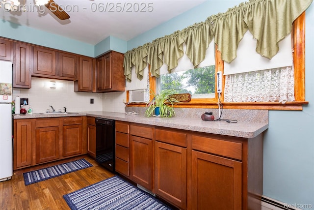 4144 Hillcrest Dr, Warren, MI 48092 - kitchen featuring black dishwasher, a baseboard heating unit, dark wood-type flooring, a ceiling fan, and decorative backsplash