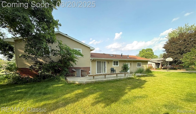 3417 Ramada Dr, Highland, MI 48356 - back of property with a lawn and brick siding