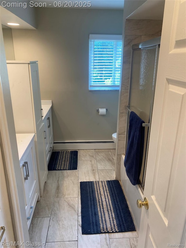 3417 Ramada Dr, Highland, MI 48356 - bathroom featuring vanity, a shower with shower door, baseboard heating, and marble finish floors