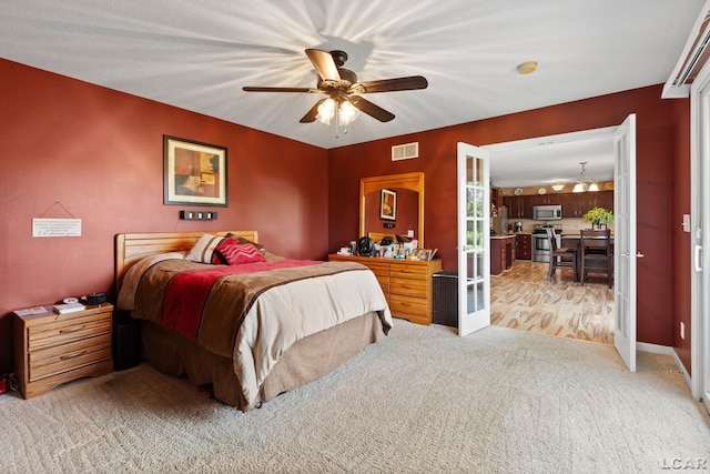 3564 Sapphire Dr, Adrian, MI 49221 - bedroom featuring light colored carpet, french doors, and ceiling fan