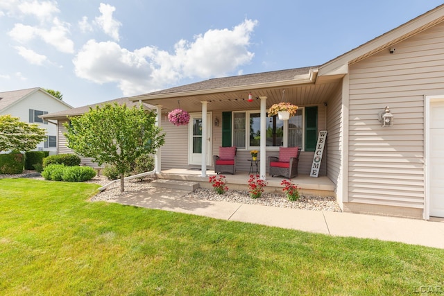3564 Sapphire Dr, Adrian, MI 49221 - rear view of house featuring covered porch and a lawn