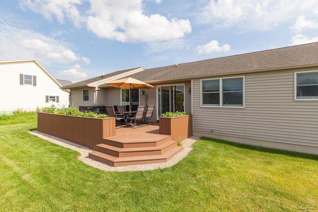 3564 Sapphire Dr, Adrian, MI 49221 - rear view of house with a wooden deck, a lawn, outdoor dining area, and roof with shingles