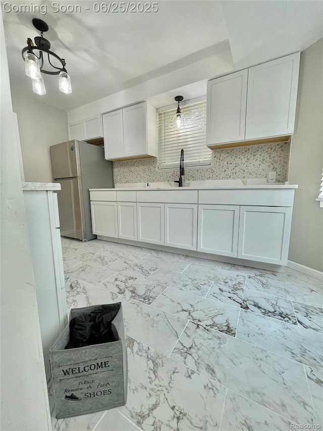 10351 Kramer, Detroit, MI 48204 - kitchen with freestanding refrigerator, light countertops, light marble finish flooring, and white cabinetry