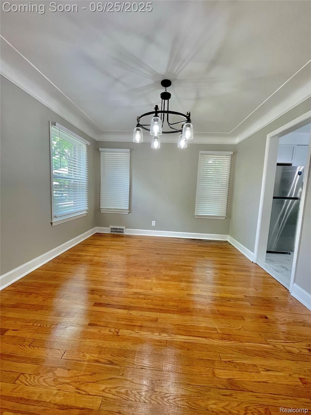 10351 Kramer, Detroit, MI 48204 - unfurnished room with a chandelier and light wood finished floors