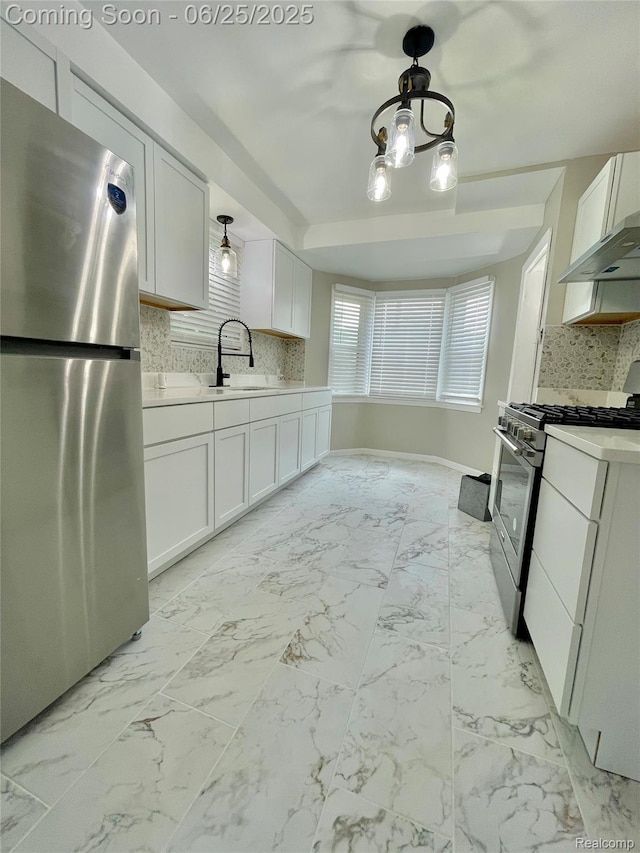 10351 Kramer, Detroit, MI 48204 - kitchen featuring appliances with stainless steel finishes, light countertops, white cabinetry, range hood, and decorative backsplash