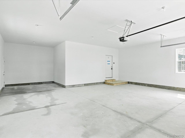 9711 Crawford, Columbus, MI 48063 - garage featuring a garage door opener and baseboards
