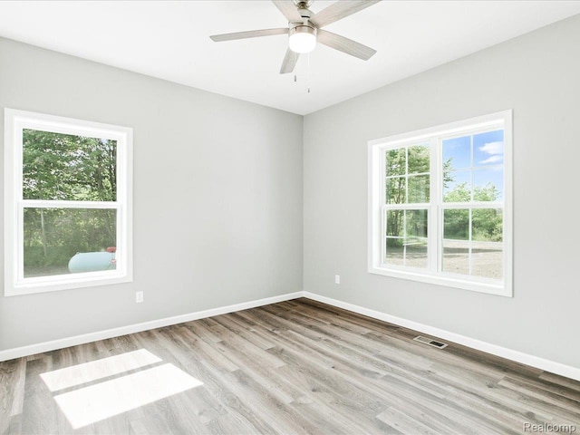 9711 Crawford, Columbus, MI 48063 - unfurnished room with healthy amount of natural light, wood finished floors, and a ceiling fan