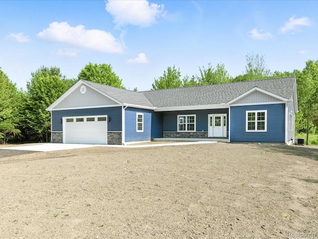9711 Crawford, Columbus, MI 48063 - ranch-style home with stone siding, an attached garage, roof with shingles, and concrete driveway