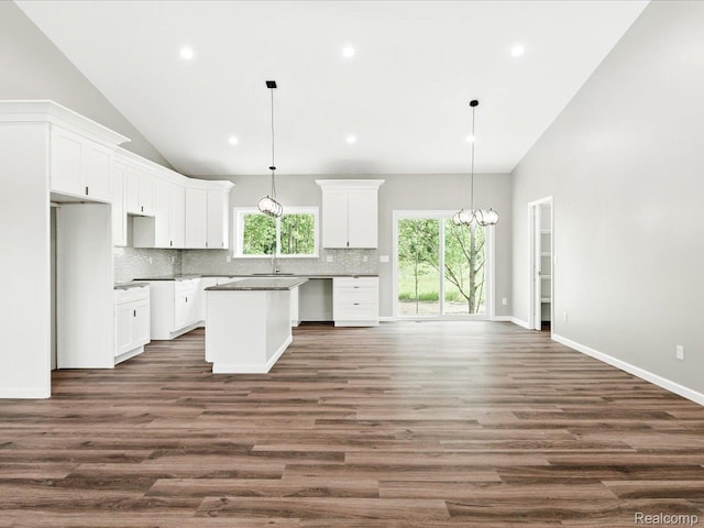 9711 Crawford, Columbus, MI 48063 - kitchen with backsplash, a kitchen island, white cabinets, dark wood-style floors, and recessed lighting