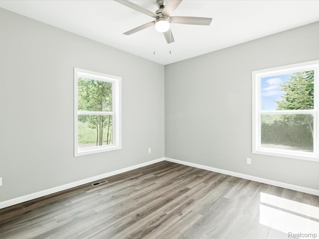 9711 Crawford, Columbus, MI 48063 - empty room with wood finished floors and ceiling fan