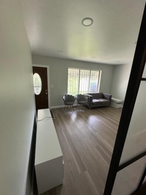 3550 Burns St, Inkster, MI 48141 - living area with wood finished floors and baseboards