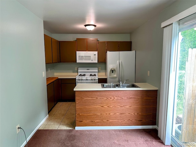 7841 Horseshoe Creek Ct, Whitmore Lake, MI 48189 - kitchen featuring white appliances, a peninsula, light colored carpet, and light countertops