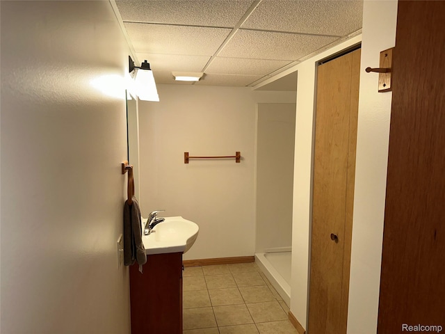 7841 Horseshoe Creek Ct, Whitmore Lake, MI 48189 - full bath featuring a drop ceiling, vanity, tile patterned flooring, and a shower