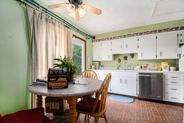 1538 Sheridan Ave, Niles, MI 49120 - kitchen featuring stainless steel dishwasher, white cabinets, a ceiling fan, and light countertops