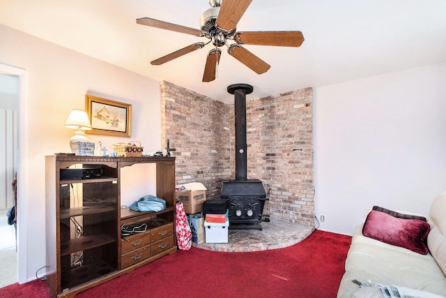 1538 Sheridan Ave, Niles, MI 49120 - carpeted living room with a wood stove and a ceiling fan