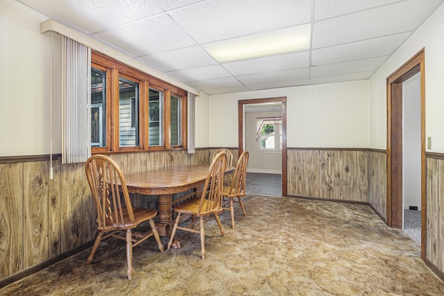 1507 Annie Ave NW, Grand Rapids, MI 49504 - carpeted dining room with a wainscoted wall, wood walls, and a drop ceiling