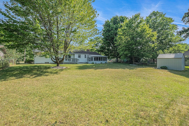 1136 3 Mile Rd NW, Grand Rapids, MI 49544 - view of yard with a storage unit and a sunroom